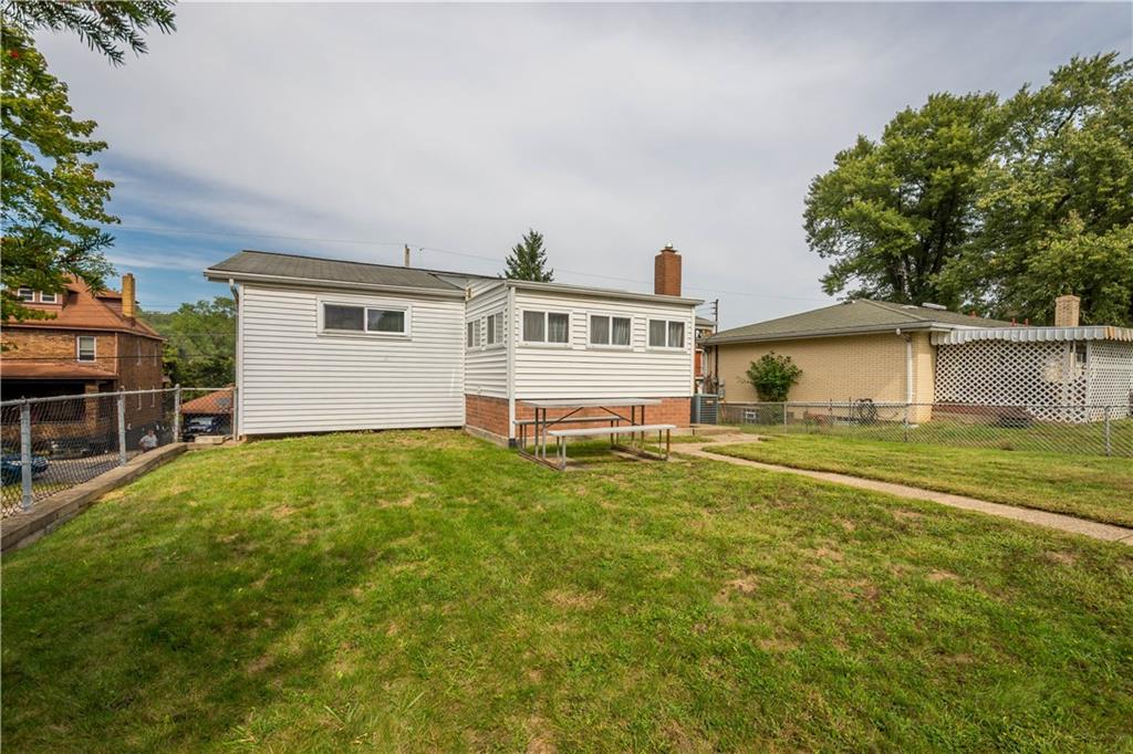 45 Harlem Avenue McKees Rocks, PA 15136 - Photo 27 of 31 a front view of a house with a garden