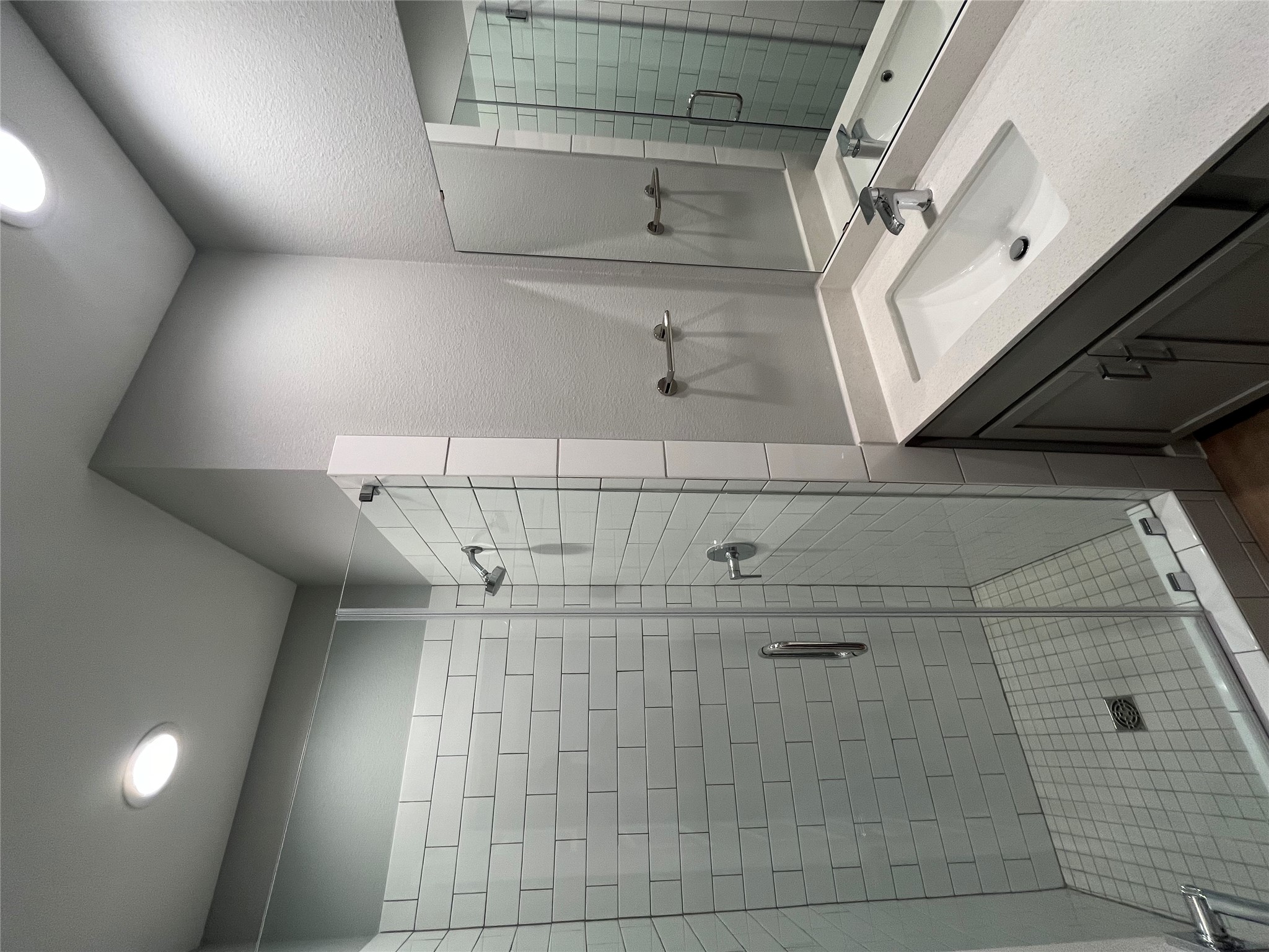 11409 Pastini Circle Manchaca, TX 78652 - Photo 10 of 18 a bathroom with a shower sink and mirror
