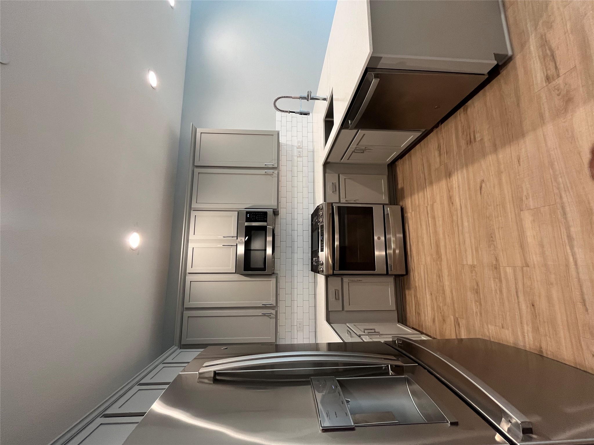 11409 Pastini Circle Manchaca, TX 78652 - Photo 6 of 18 a kitchen with stainless steel appliances a refrigerator sink and microwave
