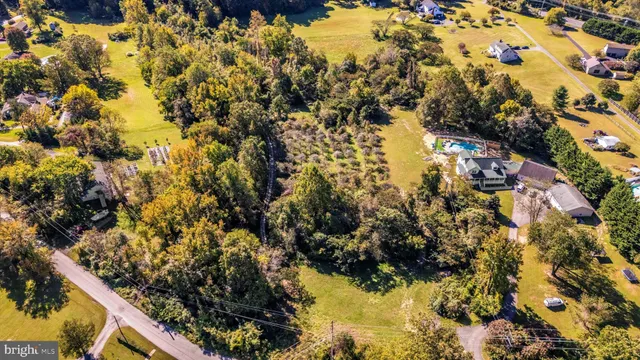 an aerial view of residential house with parking space