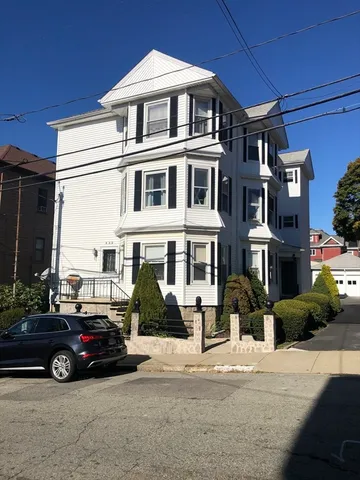 a car parked in front of a building
