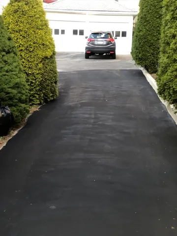 a kitchen with granite countertop a sink cabinets and stainless steel appliances