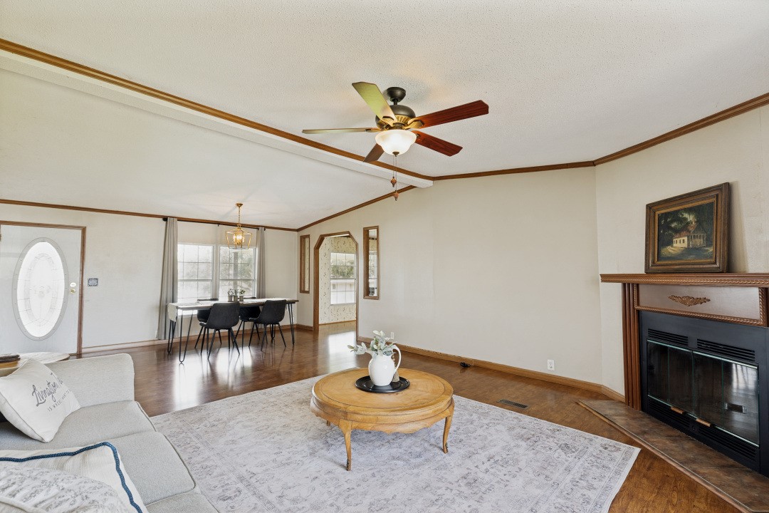 207 Vivian Road Onalaska, TX 77360 - Photo 10 of 34 a living room with furniture and a fireplace