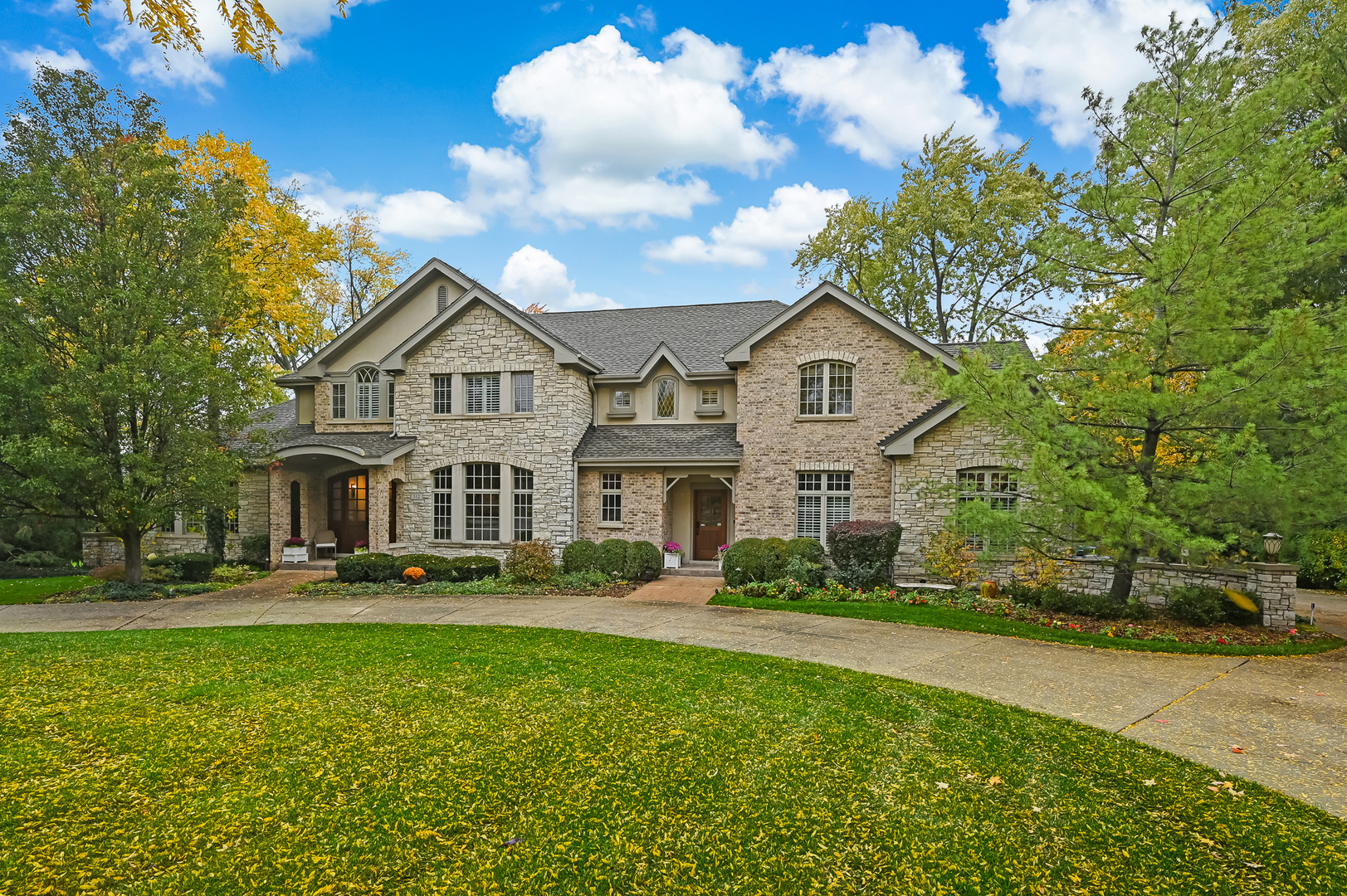 512 Ridgemoor Drive Willowbrook, IL 60527 - Photo 1 of 31 a front view of a house with a garden and trees