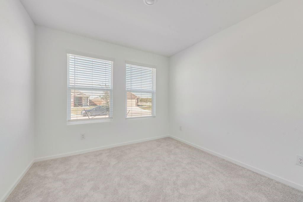 3710 Oleander Place Sherman, TX 75092 - Photo 15 of 24 an empty room with windows