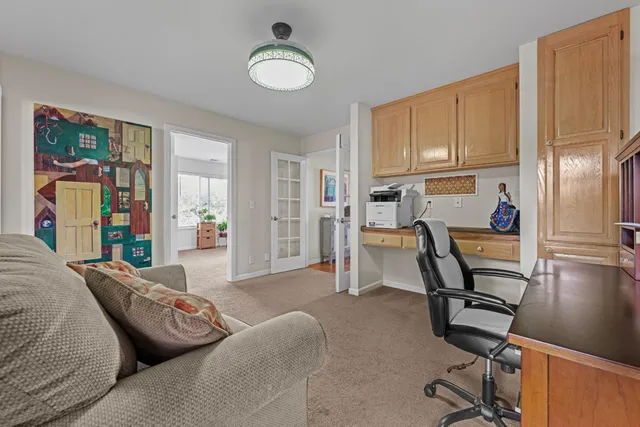 a view of a livingroom with furniture and a window