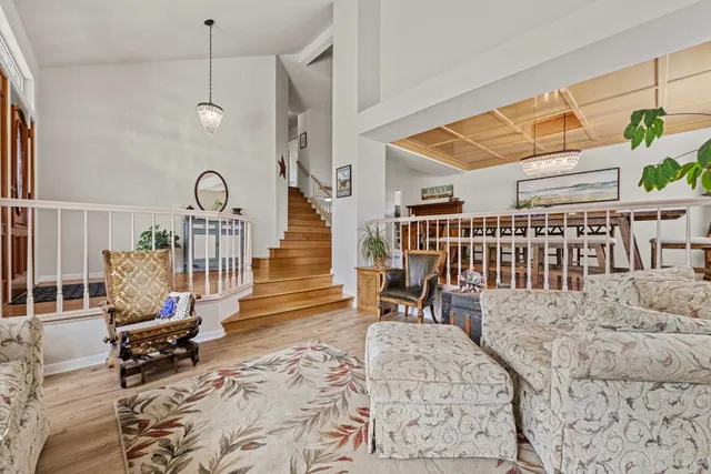 a bedroom with furniture and a chandelier