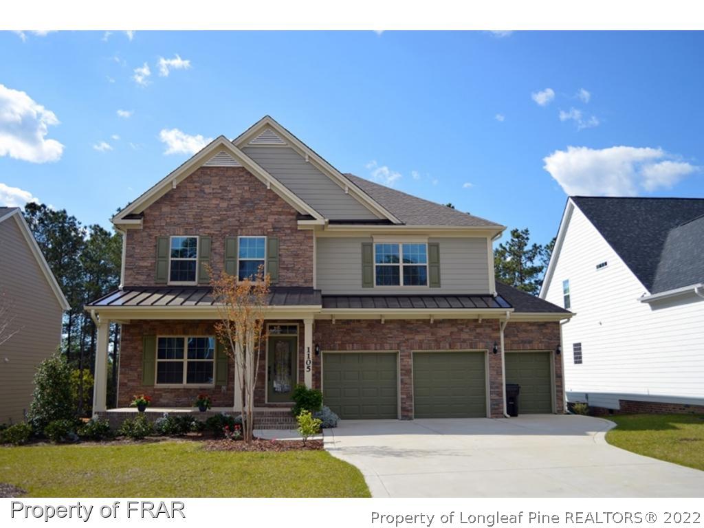 1105 Micahs Way North Spring Lake, NC 28390 - Photo 1 of 32 a front view of a house with a yard
