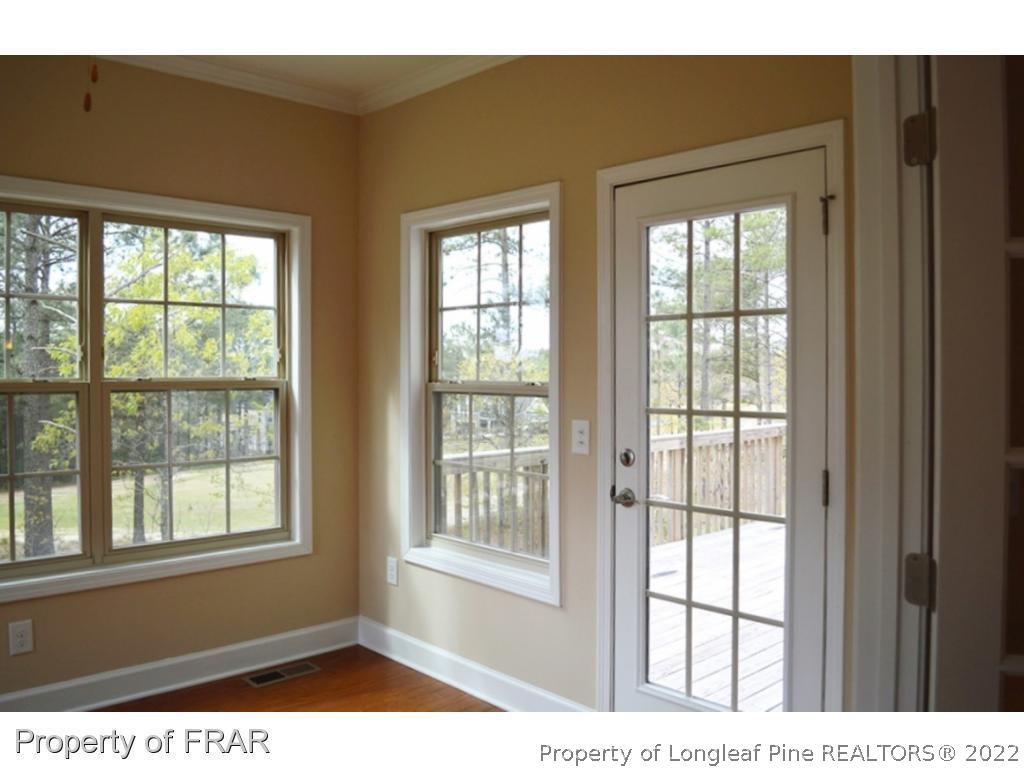 1105 Micahs Way North Spring Lake, NC 28390 - Photo 16 of 32 a view of an empty room with a window