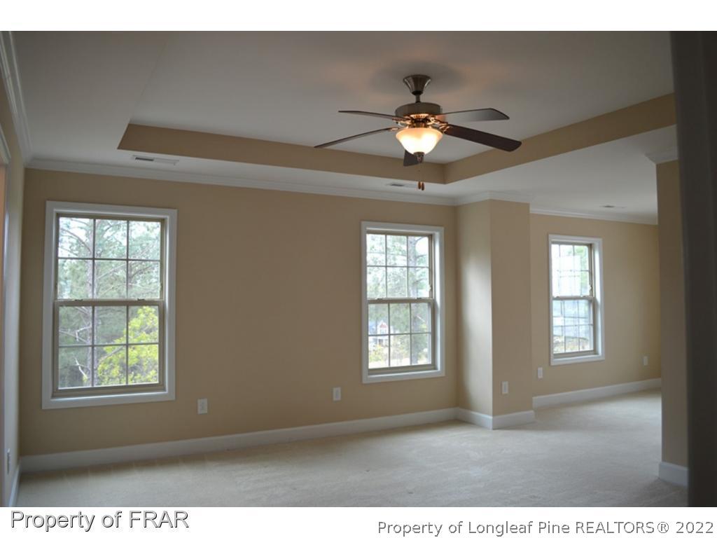 1105 Micahs Way North Spring Lake, NC 28390 - Photo 18 of 32 a view of an empty room with a window