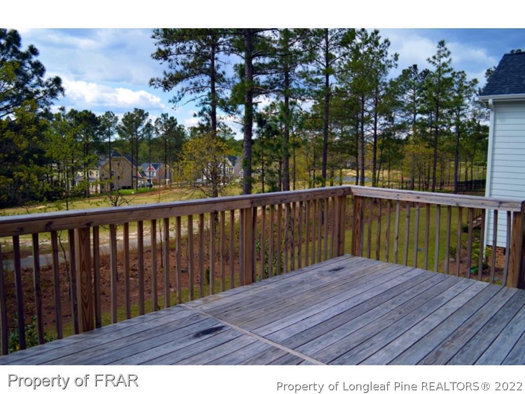 1105 Micahs Way North Spring Lake, NC 28390 - Photo 24 of 32 a balcony with wooden floor