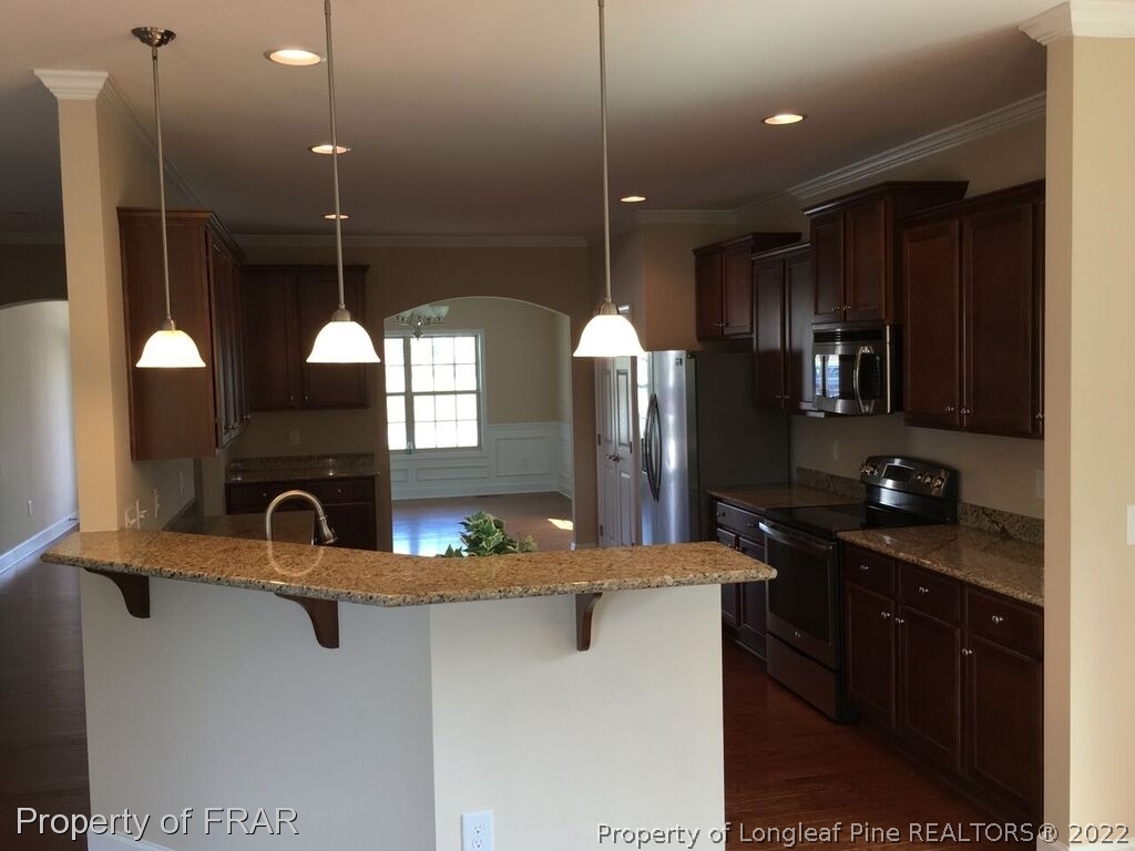 1105 Micahs Way North Spring Lake, NC 28390 - Photo 29 of 32 a kitchen with lots of counter space and window