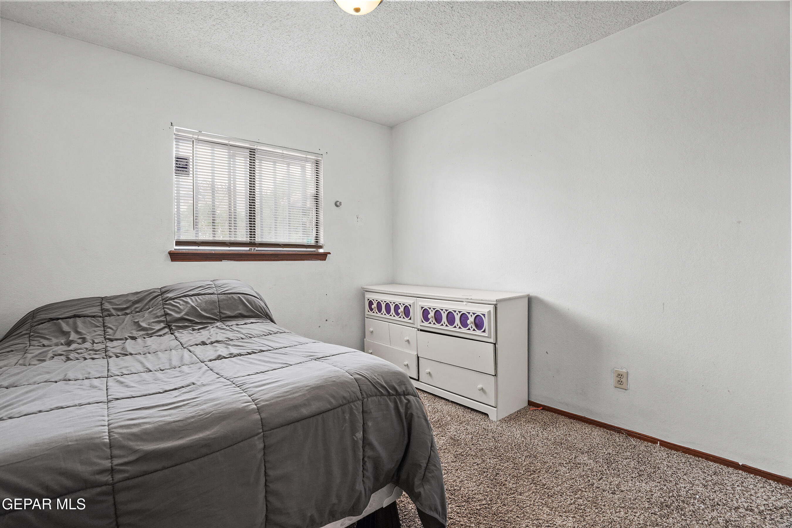 6900 Ridge Top Drive El Paso, TX 79904 - Photo 16 of 32 a bedroom with a bed and a window