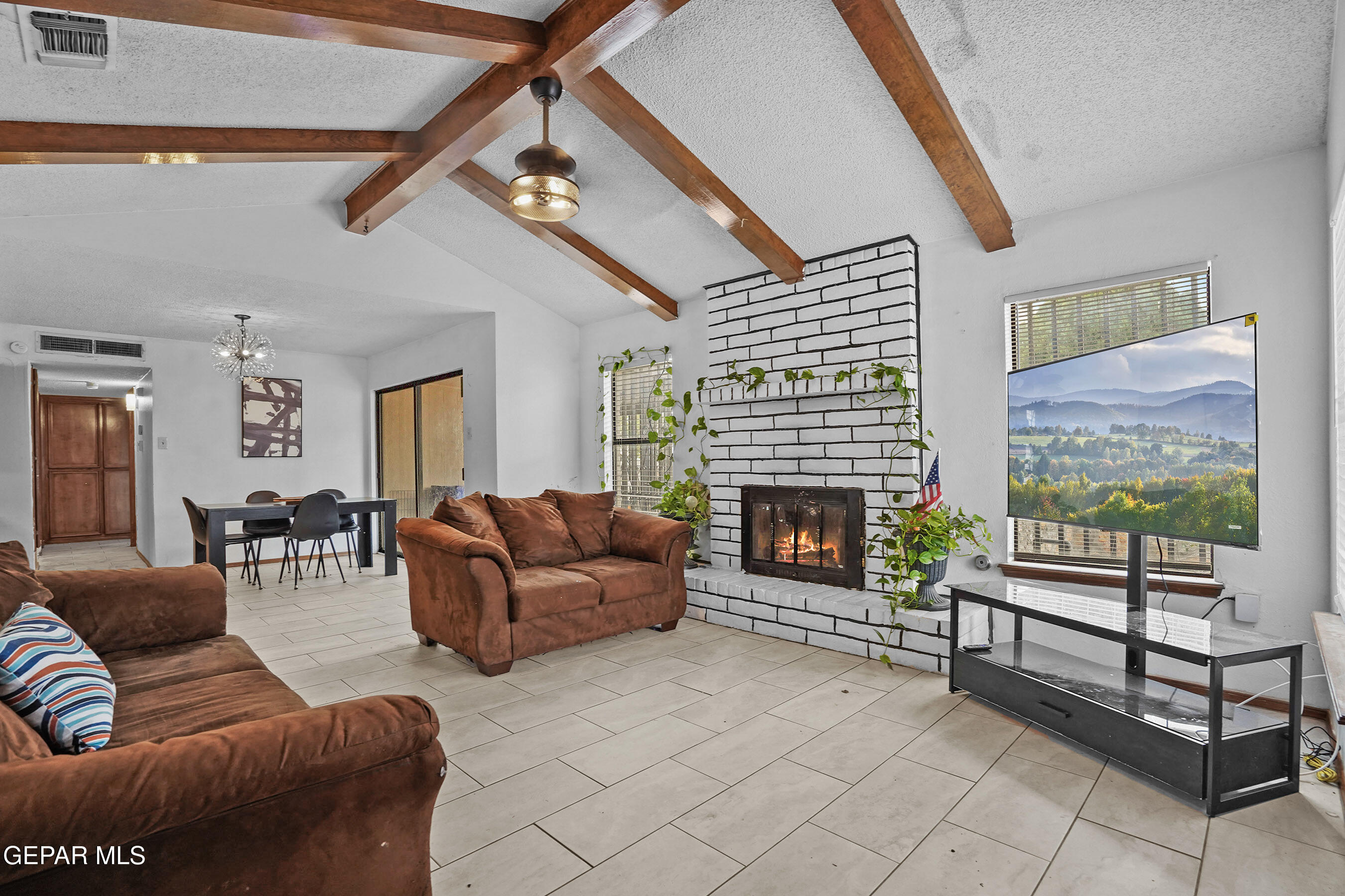 6900 Ridge Top Drive El Paso, TX 79904 - Photo 7 of 32 a living room with furniture and a fireplace
