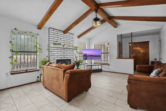a living room with furniture and a window