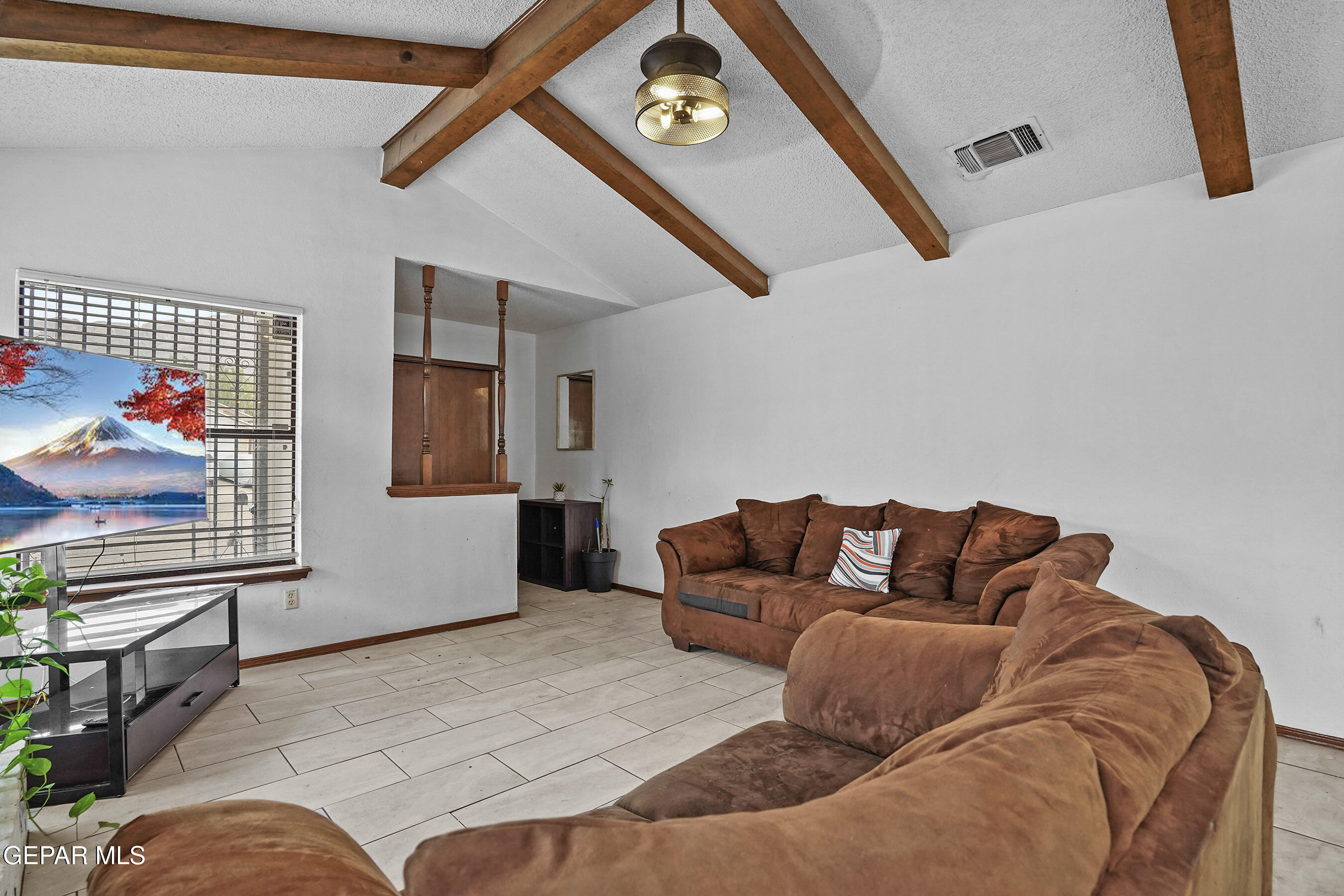 6900 Ridge Top Drive El Paso, TX 79904 - Photo 9 of 32 a living room with furniture and a window