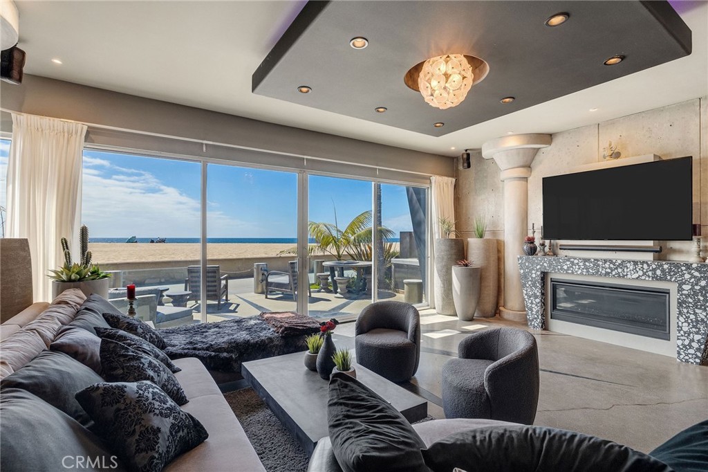 2024 The Strand Hermosa Beach, CA 90254 - Photo 11 of 65 a living room with furniture and a flat screen tv