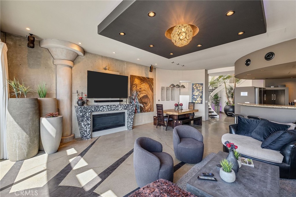 2024 The Strand Hermosa Beach, CA 90254 - Photo 14 of 65 a living room with furniture a fireplace and a flat screen tv