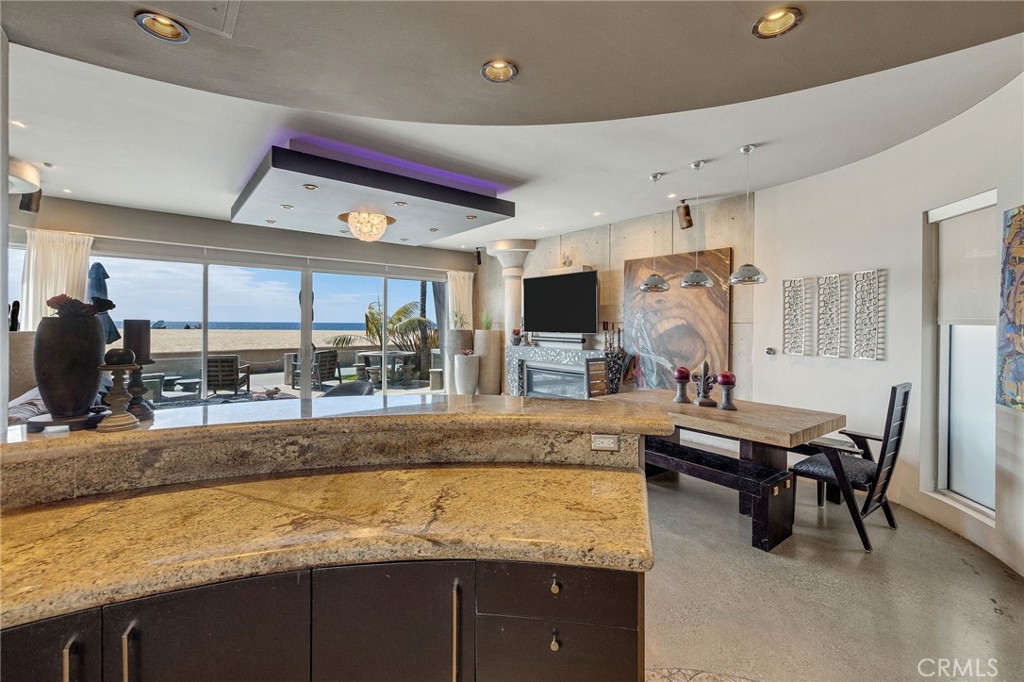 2024 The Strand Hermosa Beach, CA 90254 - Photo 19 of 65 a living room with furniture and a flat screen tv