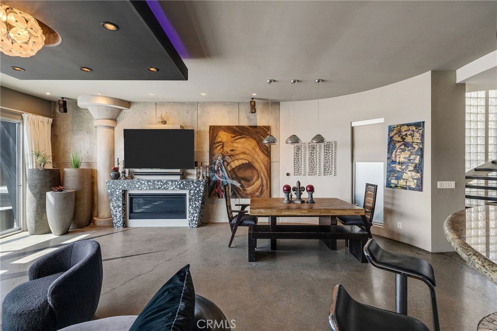 2024 The Strand Hermosa Beach, CA 90254 - Photo 20 of 65 a living room with furniture a fireplace and a flat screen tv