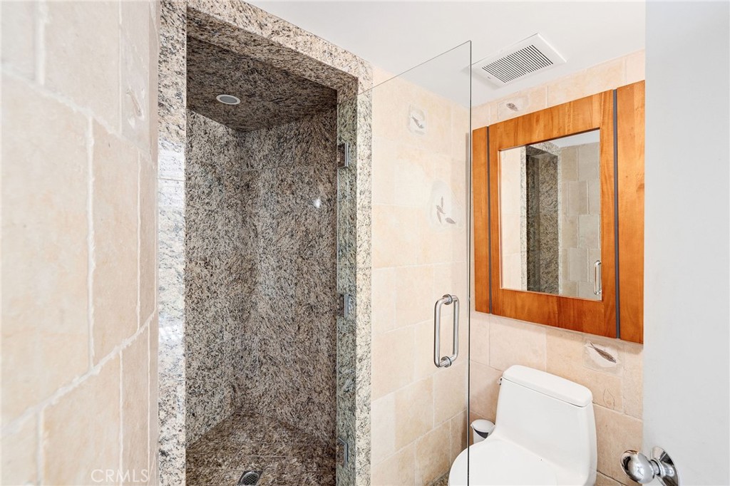 2024 The Strand Hermosa Beach, CA 90254 - Photo 26 of 65 a bathroom with a toilet and shower