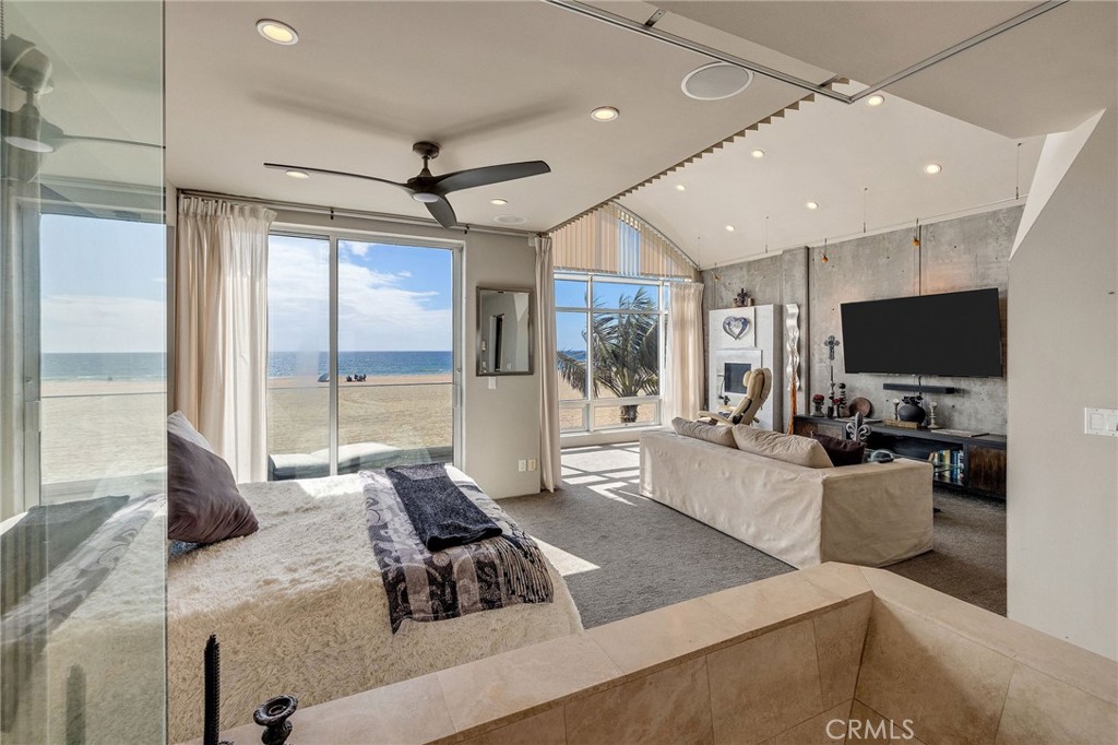 2024 The Strand Hermosa Beach, CA 90254 - Photo 28 of 65 a living room with furniture and a flat screen tv