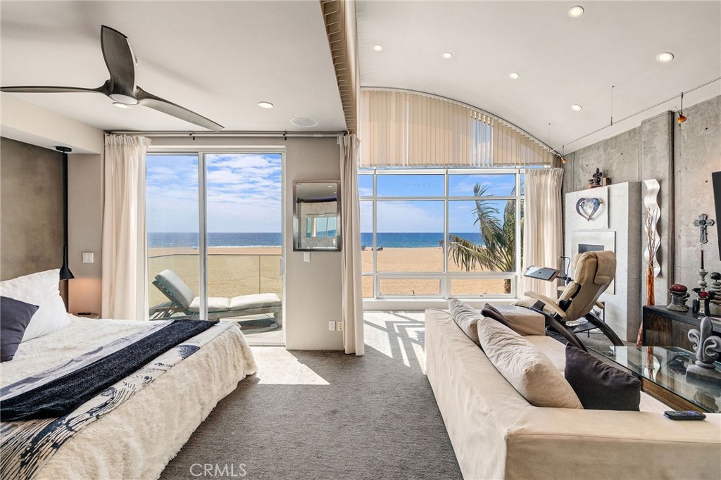 2024 The Strand Hermosa Beach, CA 90254 - Photo 29 of 65 a living room with furniture and large windows