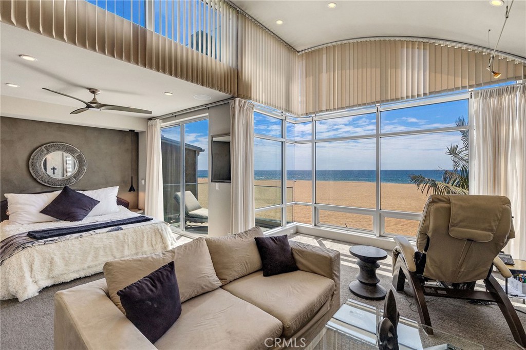 2024 The Strand Hermosa Beach, CA 90254 - Photo 30 of 65 a living room with furniture and a window