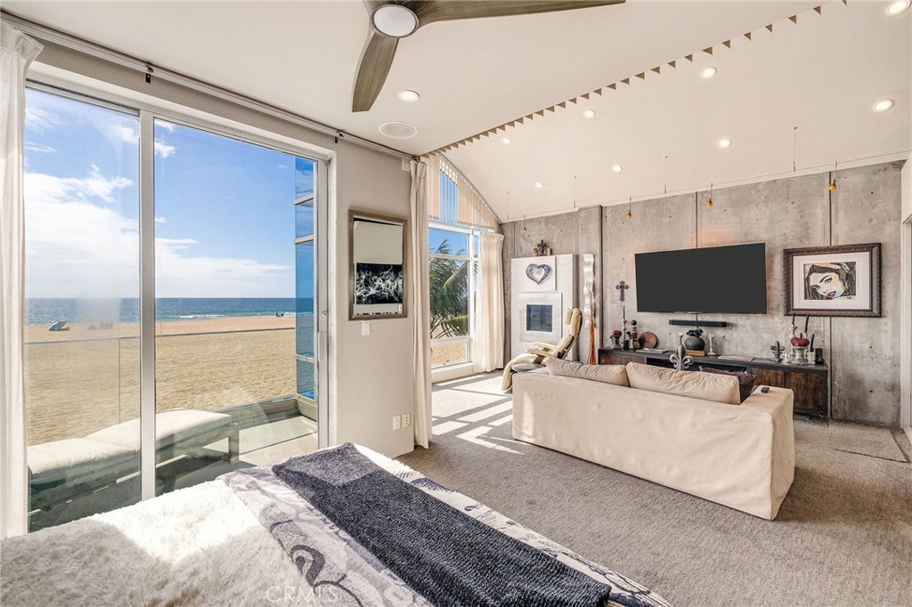 2024 The Strand Hermosa Beach, CA 90254 - Photo 34 of 65 a living room with furniture and a flat screen tv