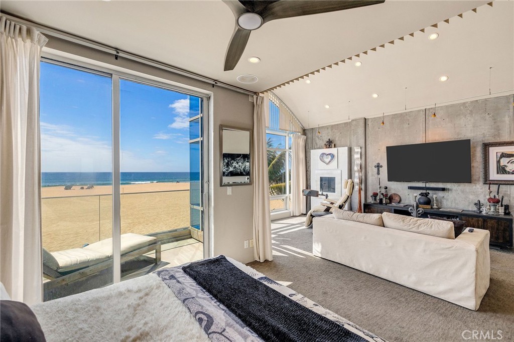 2024 The Strand Hermosa Beach, CA 90254 - Photo 35 of 65 a living room with furniture and a flat screen tv