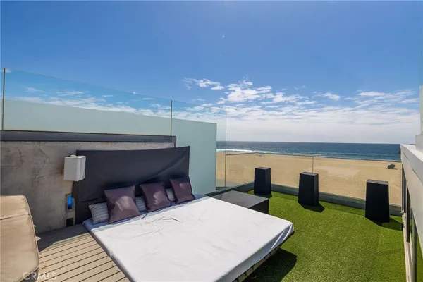 a view of a swimming pool and an outdoor seating