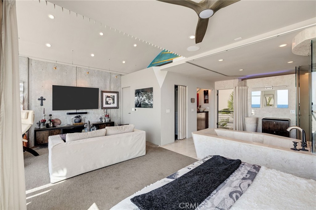 2024 The Strand Hermosa Beach, CA 90254 - Photo 50 of 65 a living room with furniture and a flat screen tv