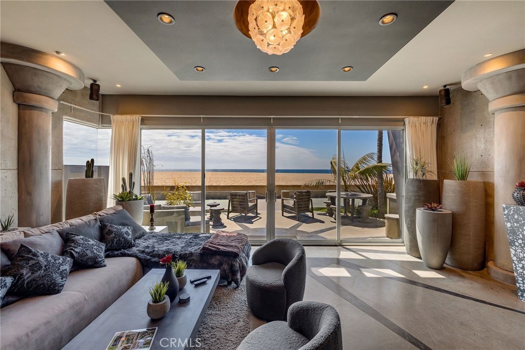 2024 The Strand Hermosa Beach, CA 90254 - Photo 9 of 65 a living room with furniture and large windows