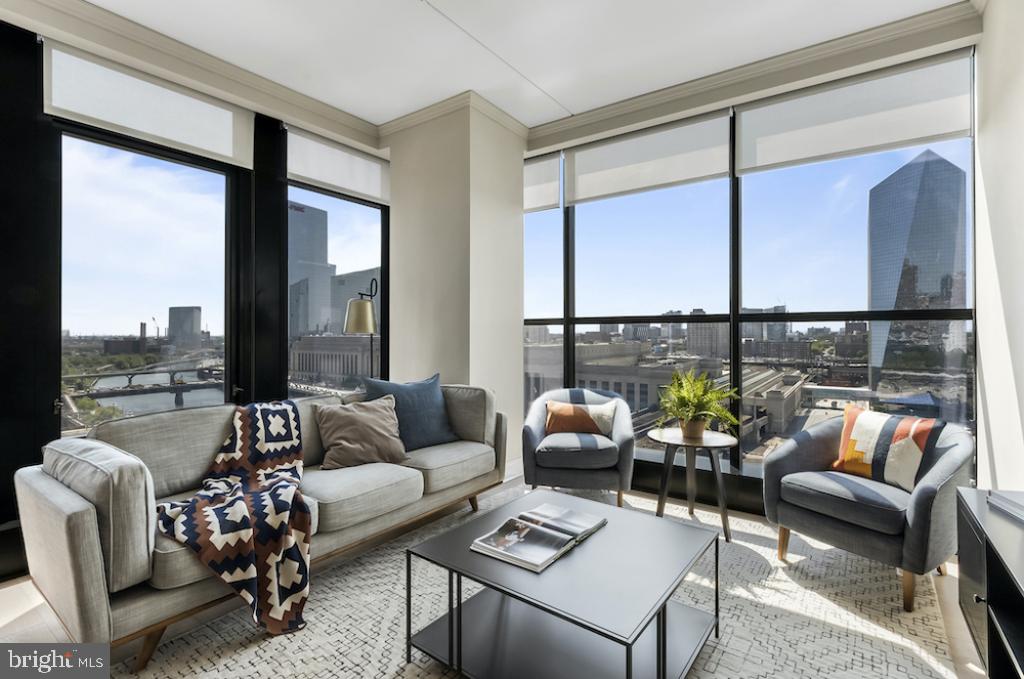 a living room with furniture and a large window