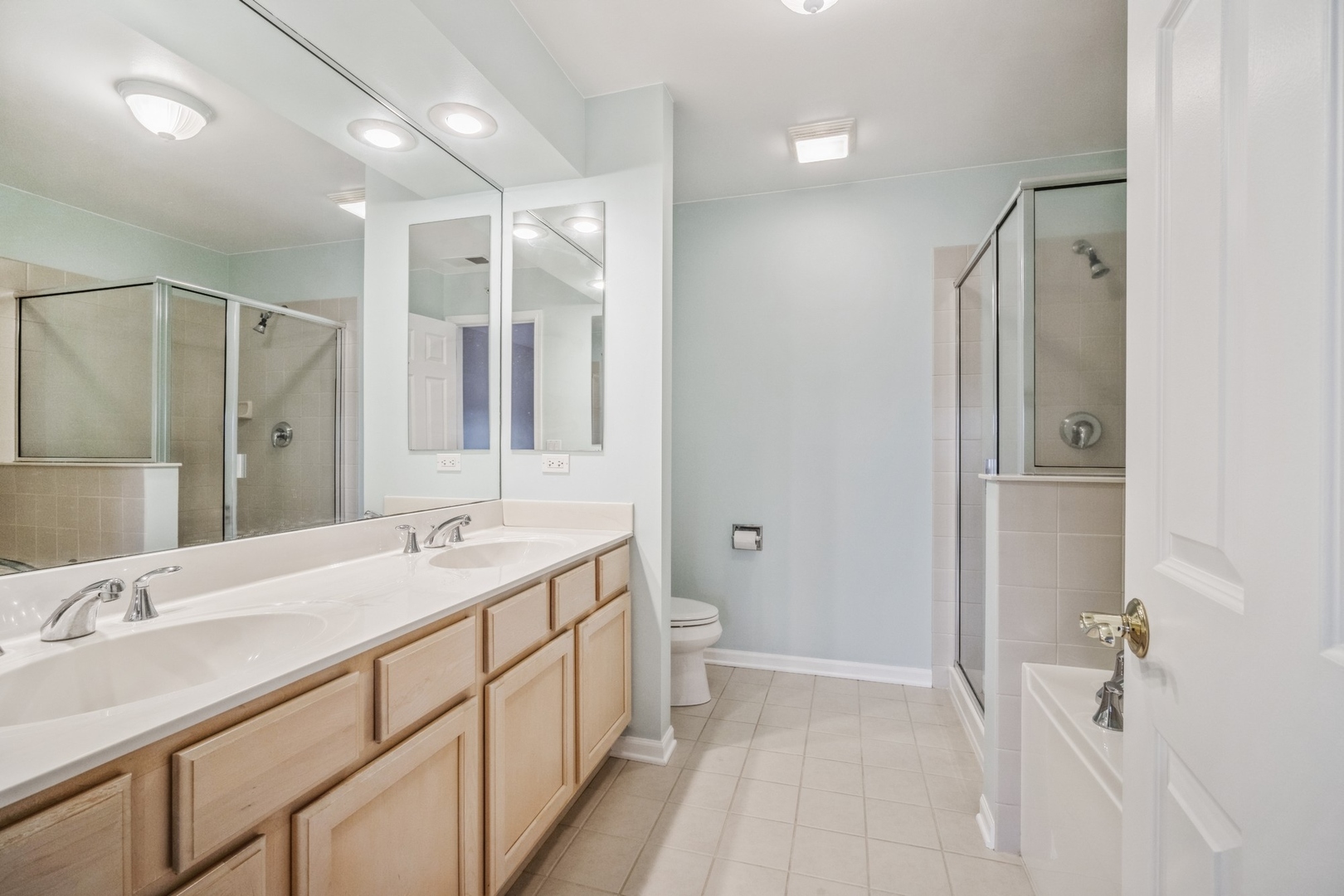 1950 Beaumont Place Northbrook, IL 60062 - Photo 6 of 10 a bathroom with a double vanity sink mirror and double