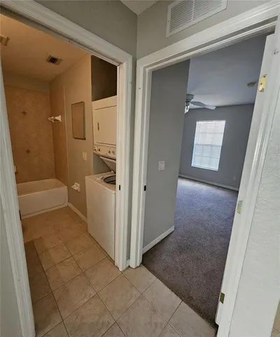 an entryway door with wooden floor