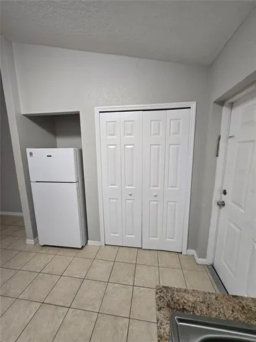 a view of a storage and utility room with washer and dryer