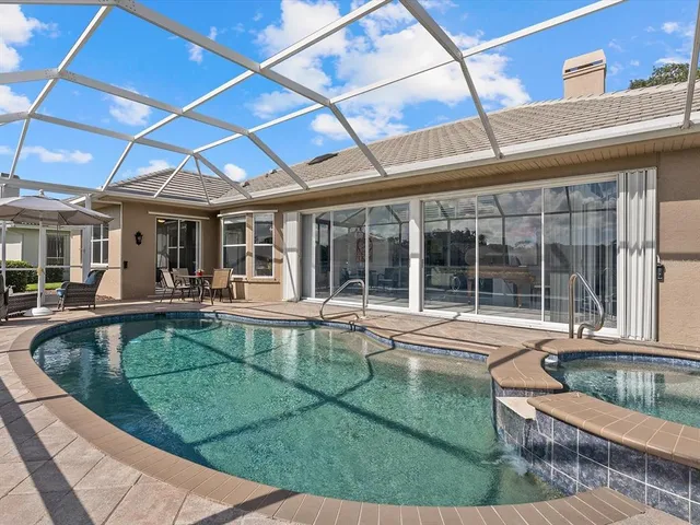 a table and chairs in front of a building