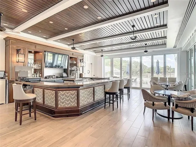 a view of swimming pool with a table and chairs