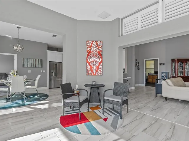 a living room with furniture and a table