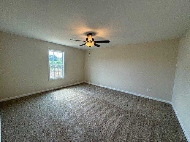 80 Modena Place Decherd, TN 37324 - Photo 8 of 14 wooden floor in an empty room with a window