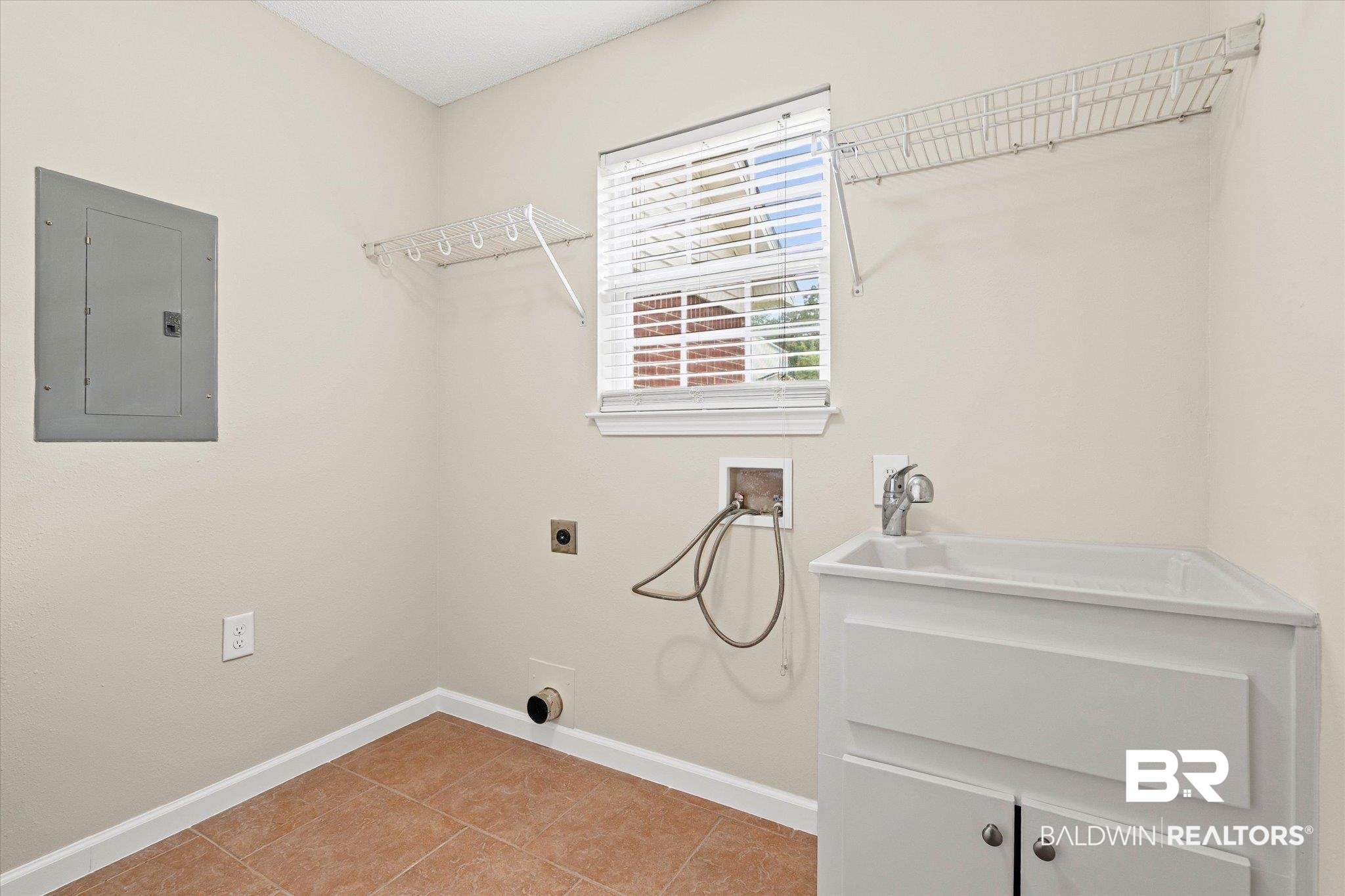 157 Bay View Drive Daphne, AL 36526 - Photo 14 of 22 Washroom with hookup for a washing machine, electric panel, light tile patterned floors, and electric dryer hookup