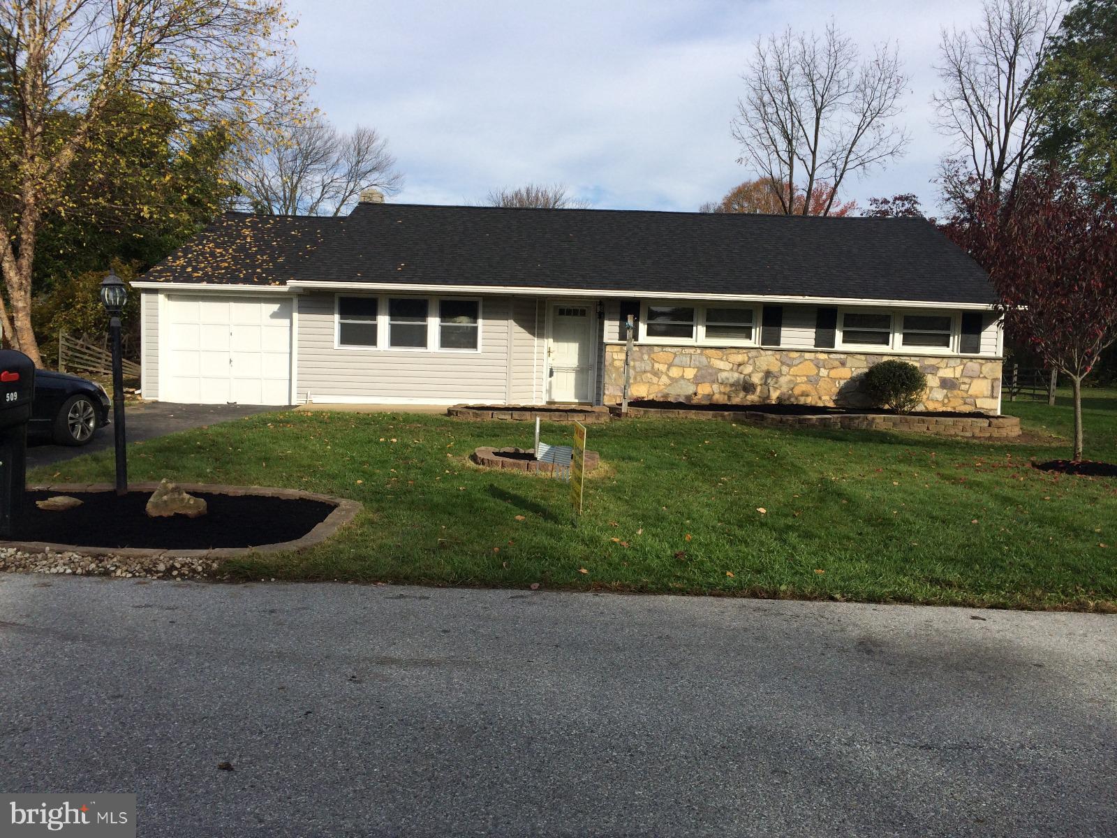 509 Winding Way Exton, PA 19341 - Photo 1 of 13 a front view of a house with garden
