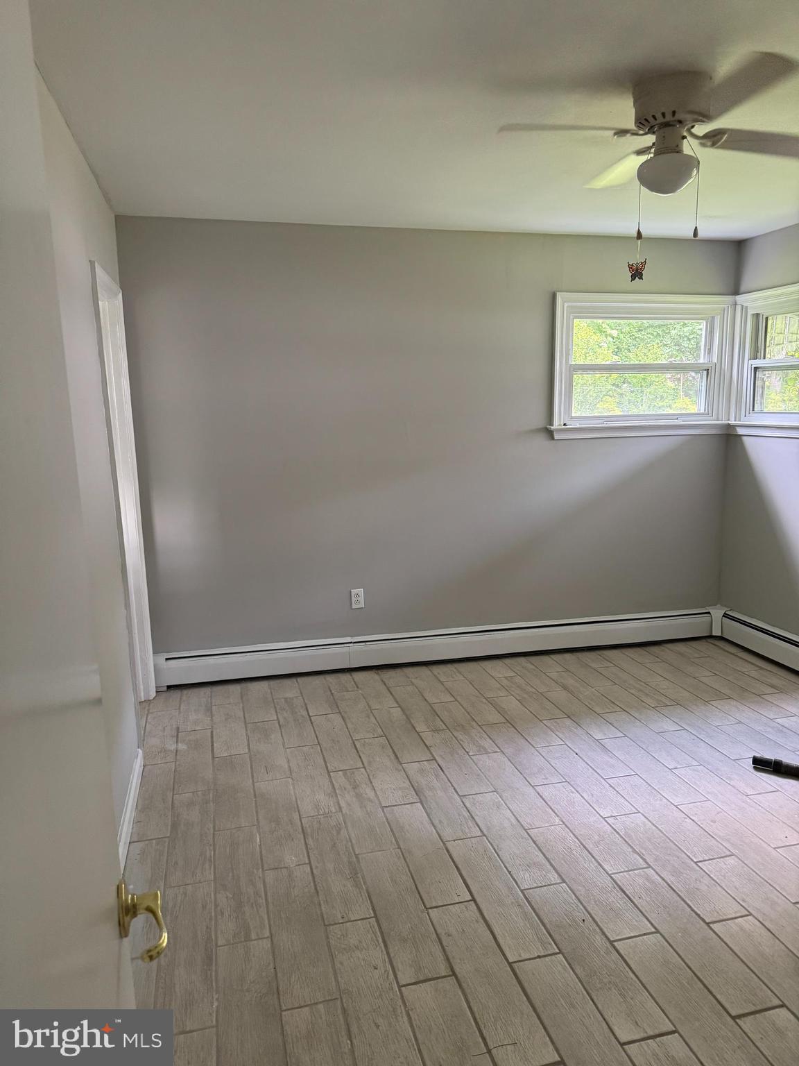 509 Winding Way Exton, PA 19341 - Photo 9 of 13 an empty room with windows and fan