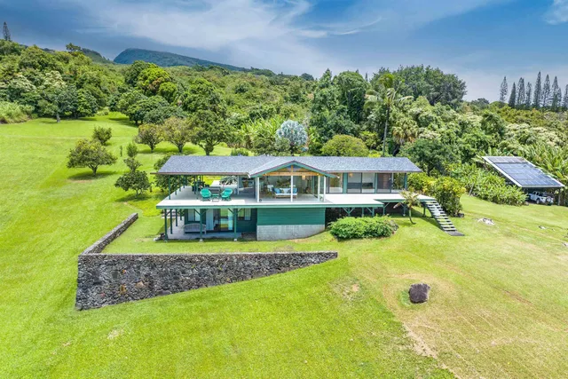 a view of house with garden space and street view