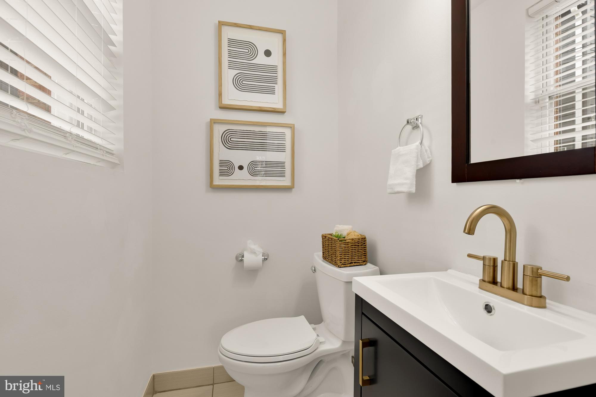 1409 G Street Northeast, Unit 5 Washington, DC 20002 - Photo 13 of 29 a bathroom with a sink mirror and toilet