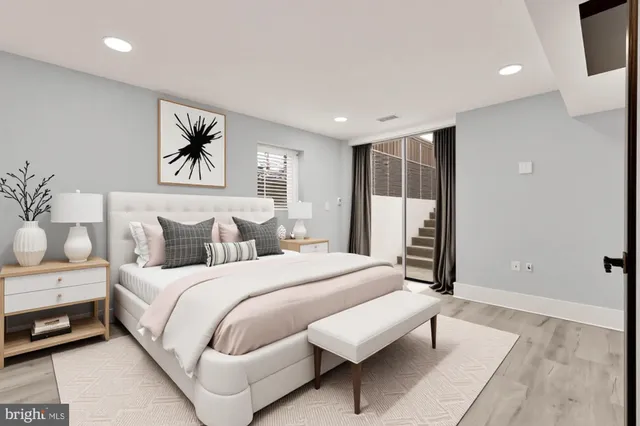 a spacious bedroom with a bed and a couch