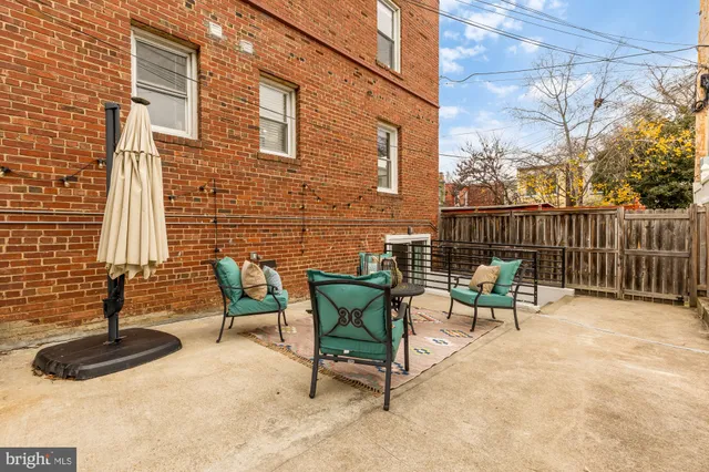 a view of a chairs with a potted plant on a bench