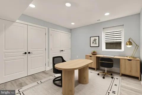 a view of a room with furniture window and wooden floor