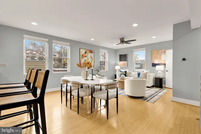 a view of a dining room with furniture window and wooden floor